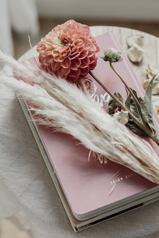 Dawn Collins Medium - spiritual readings Spiritual readings flowers laid on top of book